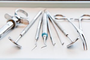 Closeup of medical tools on a tray in a dental surgery.