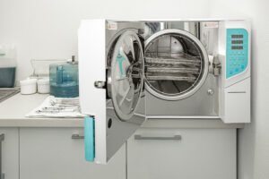 Machine for sterilizing medical equipment in autoclave. Dental office concept